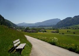 wooden bench by the road in Walchsee, Austria