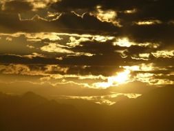 Taurus Mountains at sunset on the background of the cloudy sky