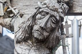 Wooden crucifix on the cross close-up