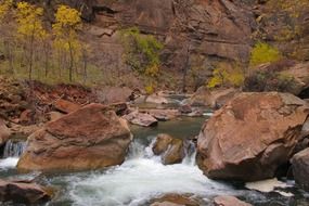 The river flows over the stone