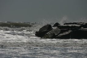 raging ocean surf in black and white