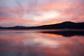 landscape of pink purple afterglow of sunset on a lake in california