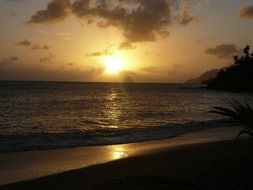 Sunset over the sea near the diamond rock