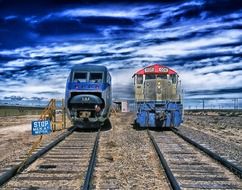 two locomotives on a railway in the desert of colorado