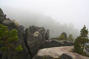 Peaks of rocks in fog in Switzerland