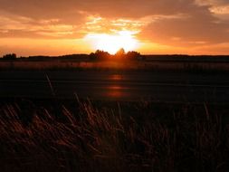 bright sunset at dark road