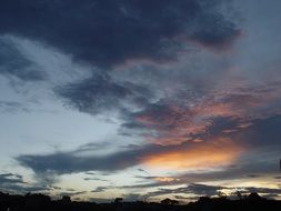 Beautiful and colorful sunrise in blue and grey clouds