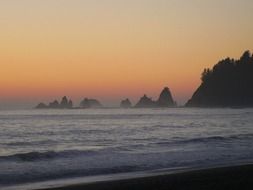 sunset in the haze over the ocean coast