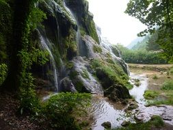 water cascade among quiet nature