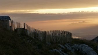 fence in the countryside at sunset