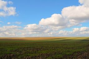 agricultural fields and cloudy sky landscape