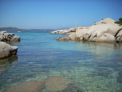 Rocks in colorful water on beautiful landscape in Sardinia, Italy