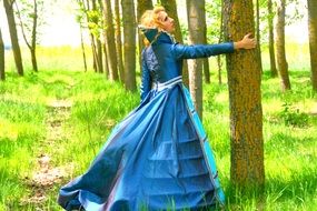 woman in the blue princess dress in the forest