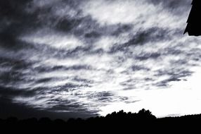 Black and white photo of white clouds over the valley