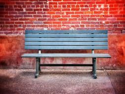 park bench on the brick wall background