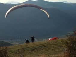 parachuting against the backdrop of beautiful scenery