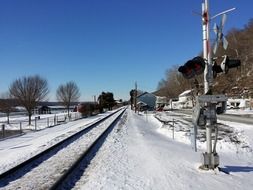 railroad in the snow on a farm