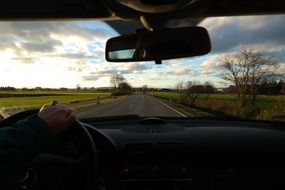 landscape and road through the windshield