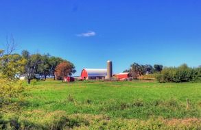 landscape of red building on a farm in Wisconsin