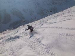 an athlete on skis slides down the mountain