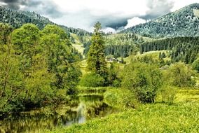 picturesque green valley on a background of mountains in Bavaria