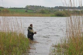 Man is fishing in the lake