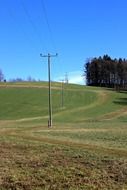 high voltage pole on a rural field