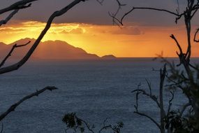 orange sunset in the clouds over the ocean