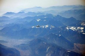 plane flying over the pyrenees mountains