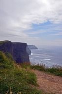 A panorama of cliffs of moher on the coast