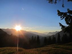 the sun from the mountains