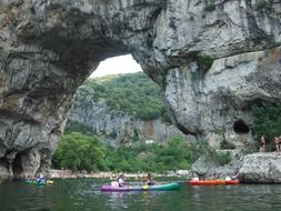 ships under a stone arch in france