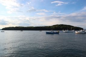 boats on the lake near the island