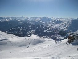 ski area with chair lift in the Alps