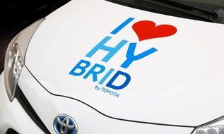 white hybrid Toyota car