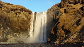 beautiful mountain waterfall in iceland