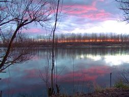 pink sunset over the river in winter