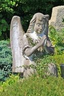 beautiful statue of angel in the forest