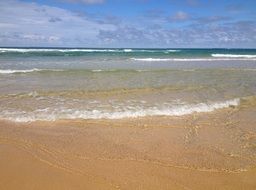 Atlantic coast with waves on the background of blue sky, biarritz