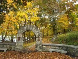 stone arched entrance in the autumn park