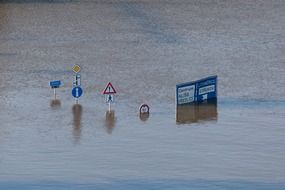 roadsigns underwater climate danger disaster environment