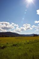 mountain green field cloud sunny sky view