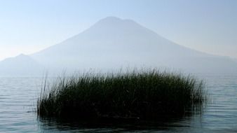 view from the water to the volcano in the haze