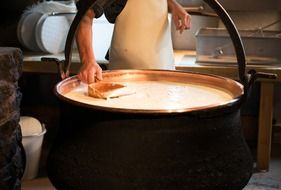 cauldron with alpine cheese in Switzerland