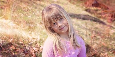 girl child with long hair photo in nature