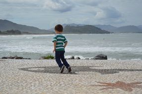 jumping baby on the beach