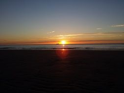 Beautiful and colorful sunset on the horizon of the sea at dusk in Netherlands