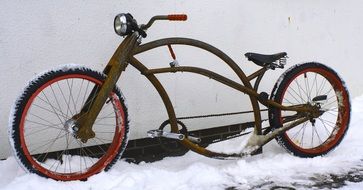 vintage chopper bike on snow