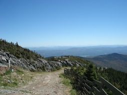 trail in the mountains with a scenic landscape on a sunny day