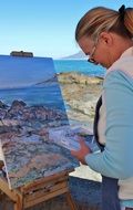 artist paints landscape